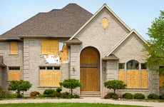 Foreclosed boarded up home