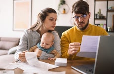 Young family managing budget and paying bills and taxes