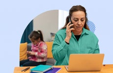 Woman working from home with a child in the background