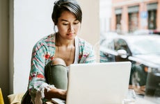 Woman works on laptop