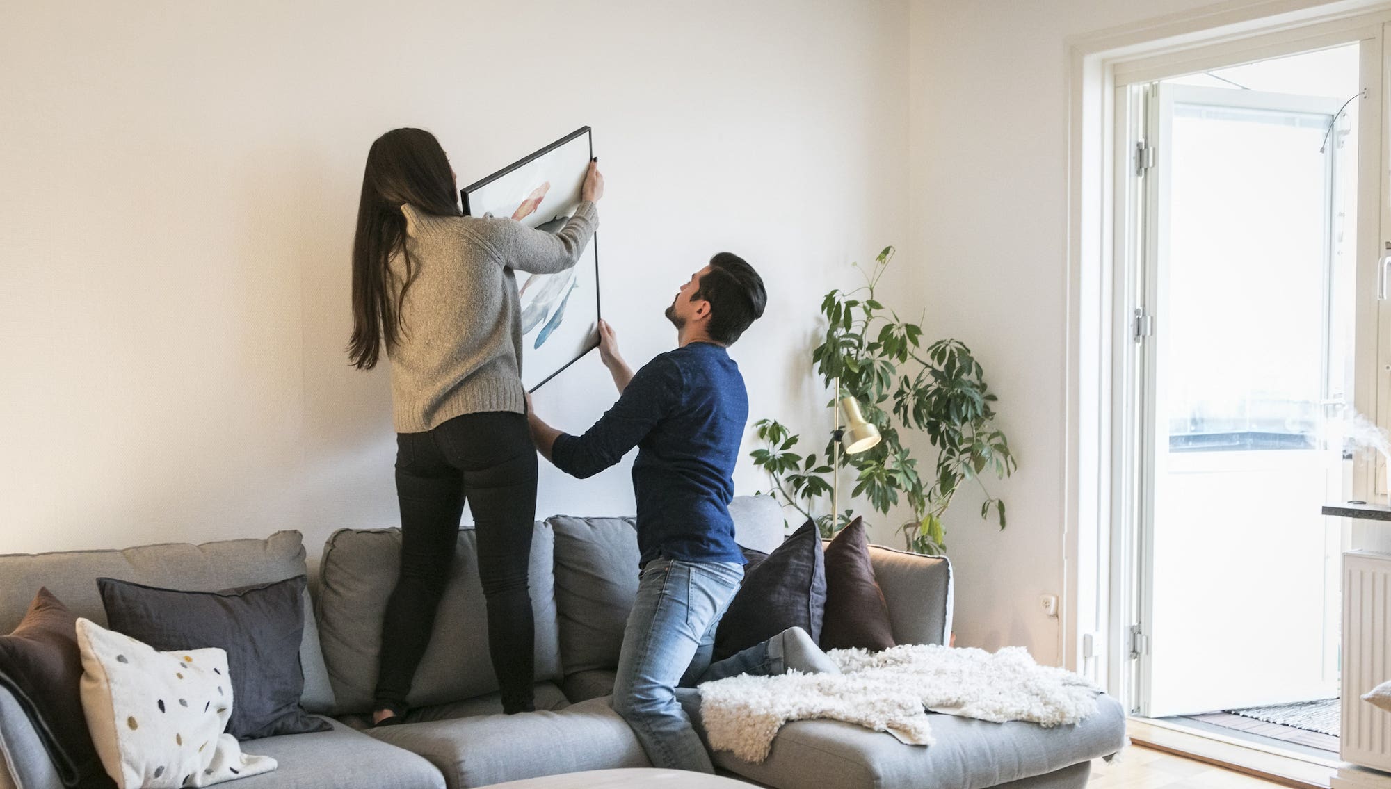 Couple holding a painting