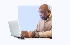 Older gentleman using a laptop