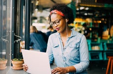 A woman does research online.