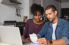 Couple reviewing bills, managing finances