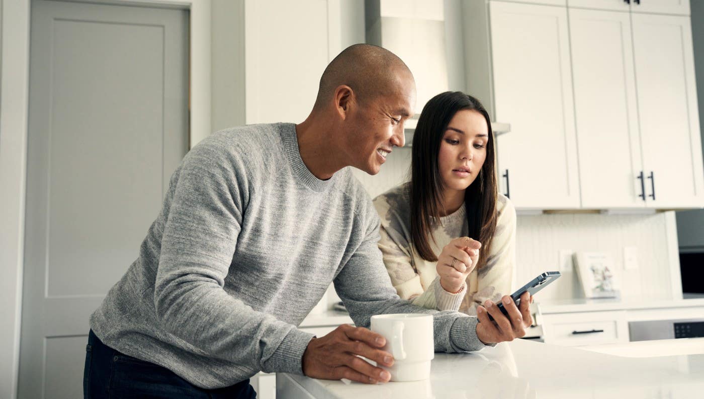 Man and woman looking at phone