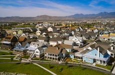 An aerial drone view of a suburban housing development in the summer. Utah, USA