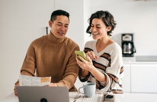 couple in the kitchen with bills