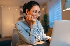 woman, using laptop while working from home