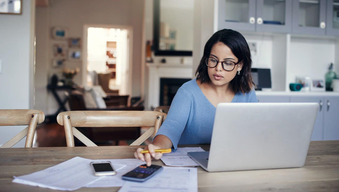 Woman sitting at table with computer